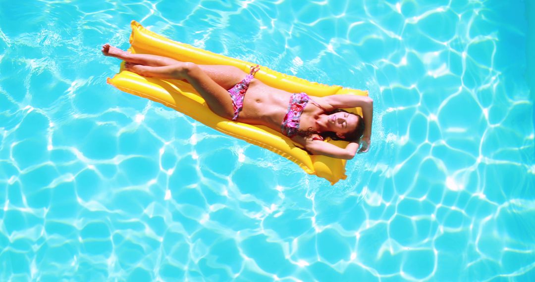 Young Woman Relaxing on Inflatable Float in Pool - Free Images, Stock Photos and Pictures on Pikwizard.com