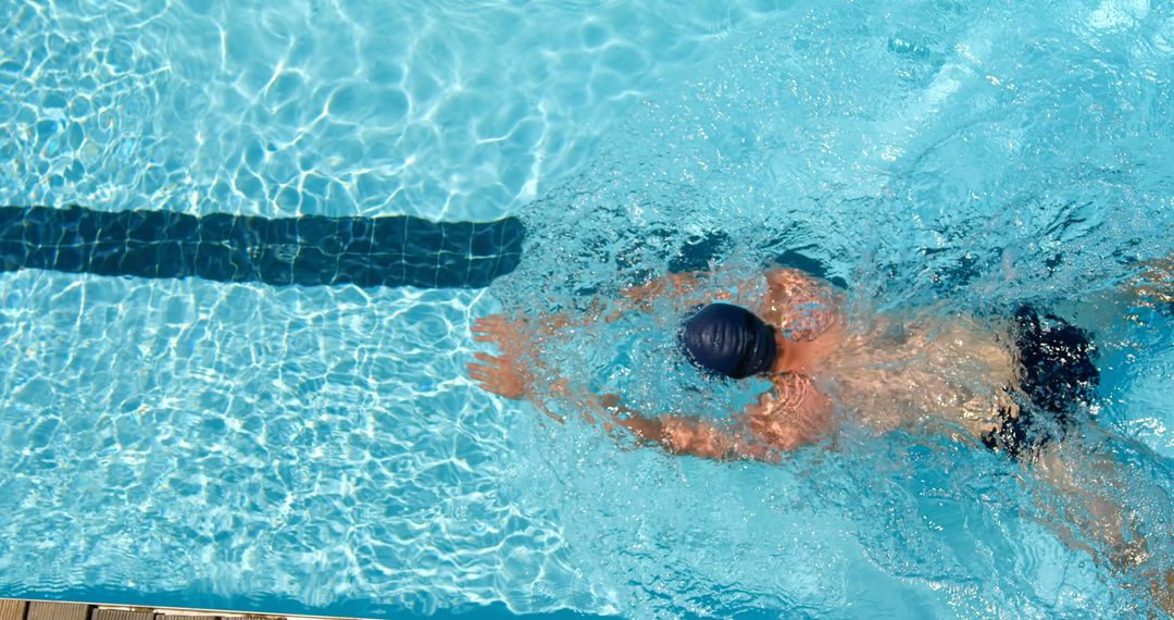 Top View of Person Swimming in Pool - Free Images, Stock Photos and Pictures on Pikwizard.com