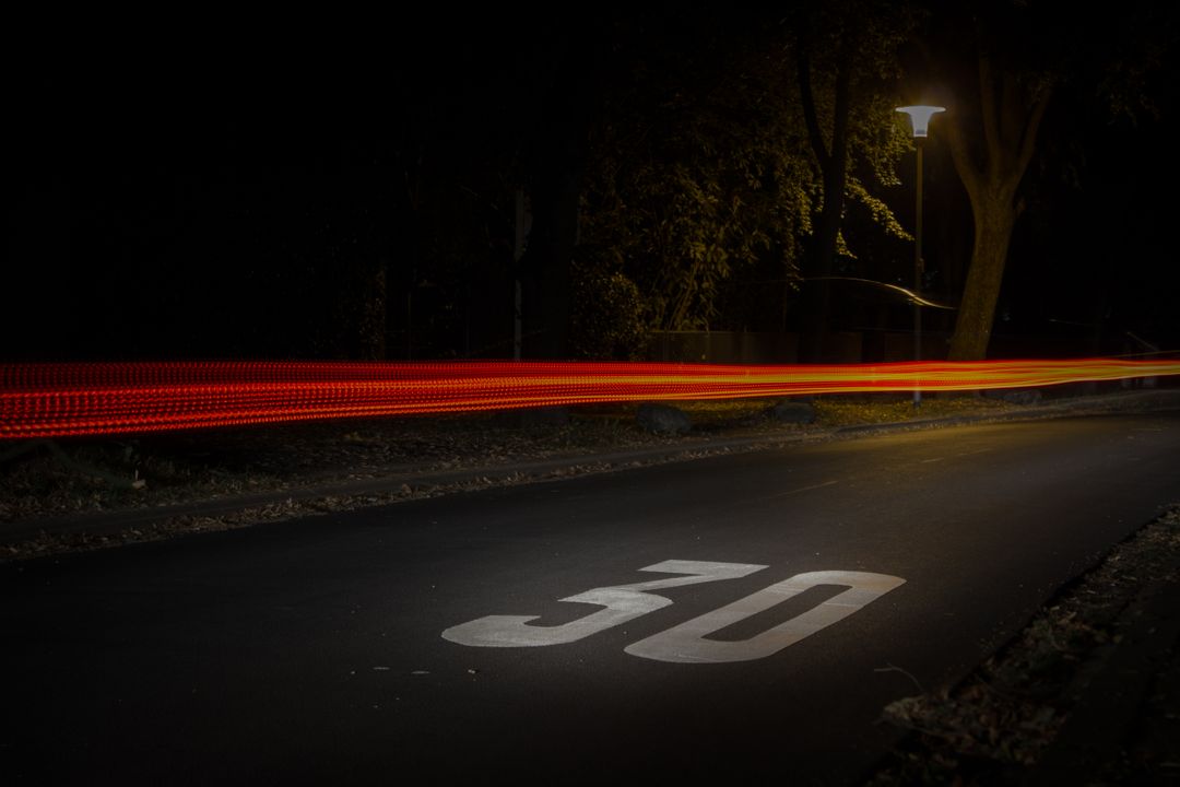Time Lapse Photography of Red and Orange Light on Road With 30 Print on Nighttime - Free Images, Stock Photos and Pictures on Pikwizard.com