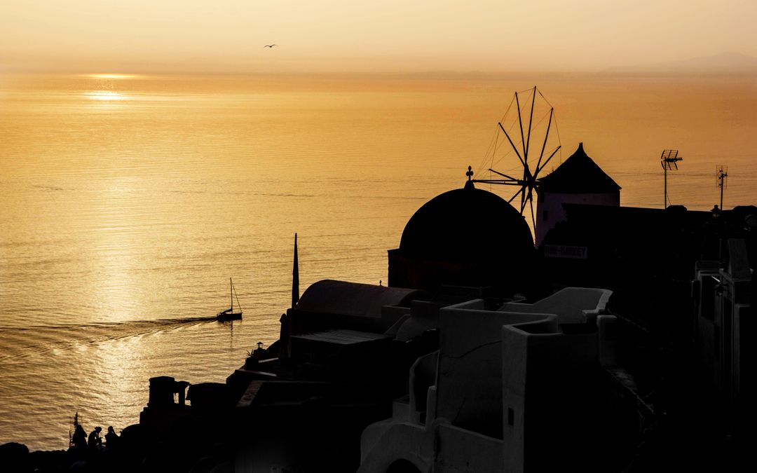 Silhouette of Windmill and Dome at Sunset in Santorini - Free Images, Stock Photos and Pictures on Pikwizard.com