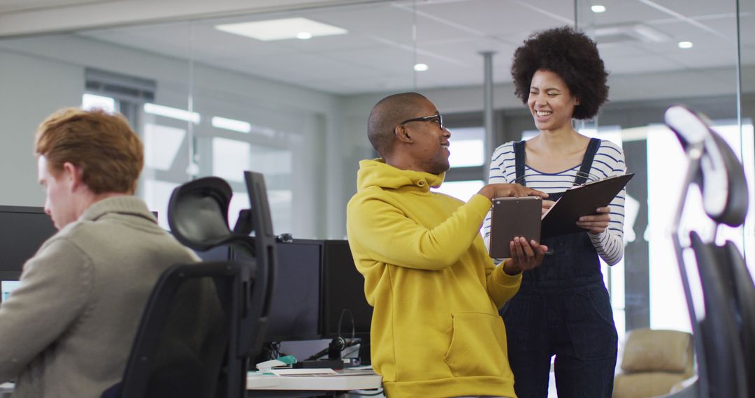 Diverse Colleagues Collaborate in Modern Office Environment