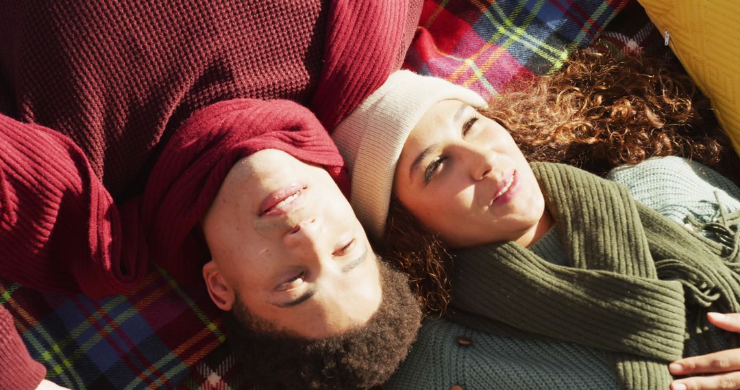 Couple Relaxing on Colorful Plaid Blanket in Outdoor Fall Setting - Free Images, Stock Photos and Pictures on Pikwizard.com