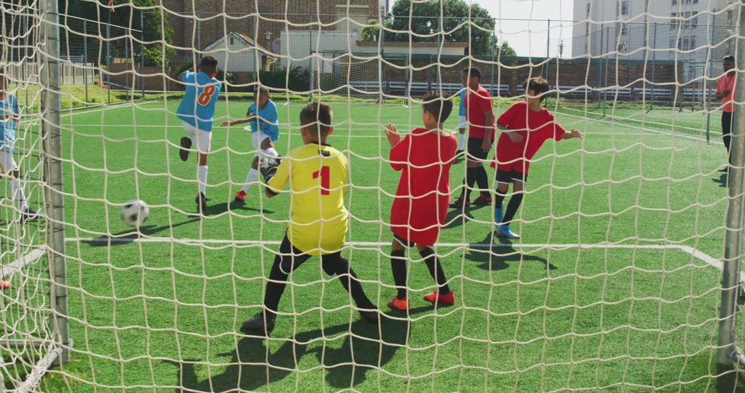 Youth Soccer Teams Competing During Match on Sports Field - Free Images, Stock Photos and Pictures on Pikwizard.com