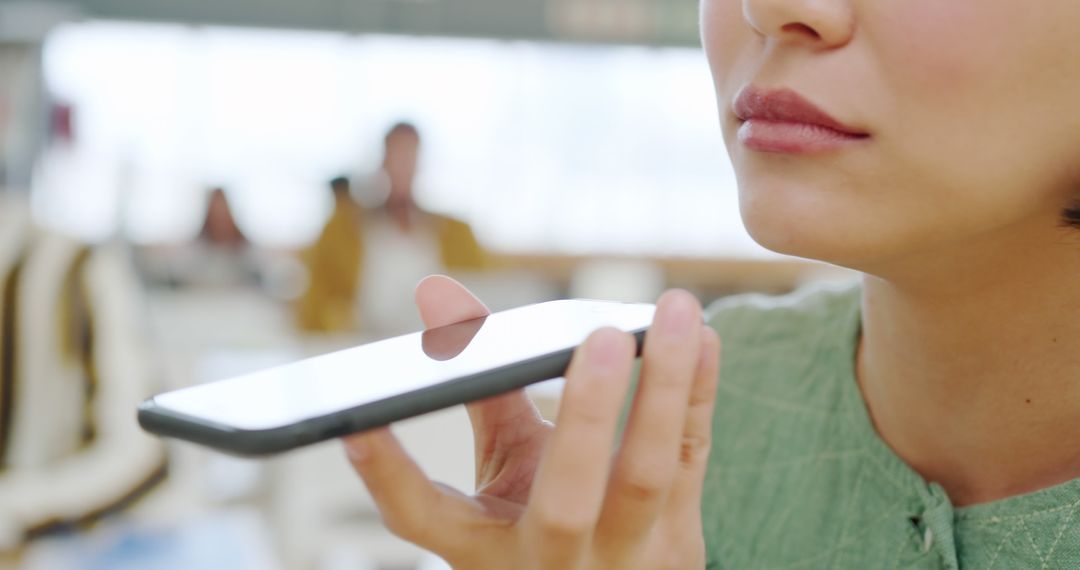 Businesswoman Collaborates Via Smartphone in Modern Office