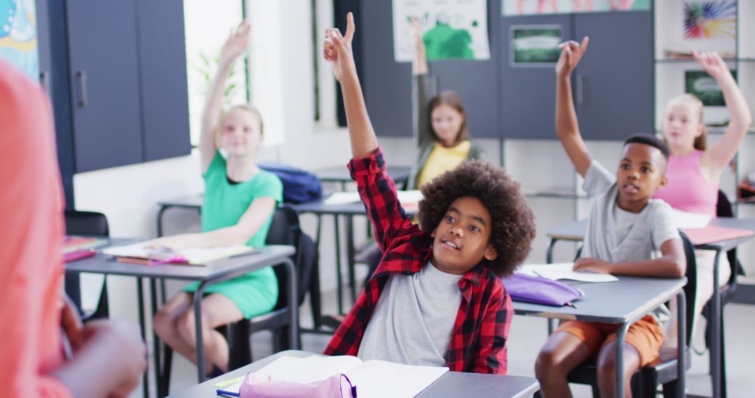 Engaged Diverse Students Raising Hands in a Classroom - Free Images, Stock Photos and Pictures on Pikwizard.com