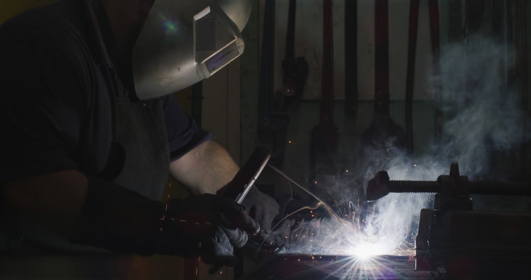 Industrial Worker Welding Metal with Protective Gear - Free Images, Stock Photos and Pictures on Pikwizard.com