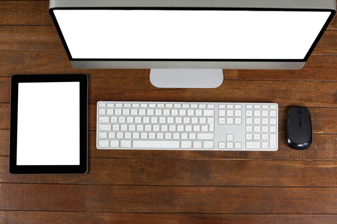 Transparent Tech: Desk with Computer, Tablet, Keyboard, Mouse on Wood - Download Free Stock Images Pikwizard.com