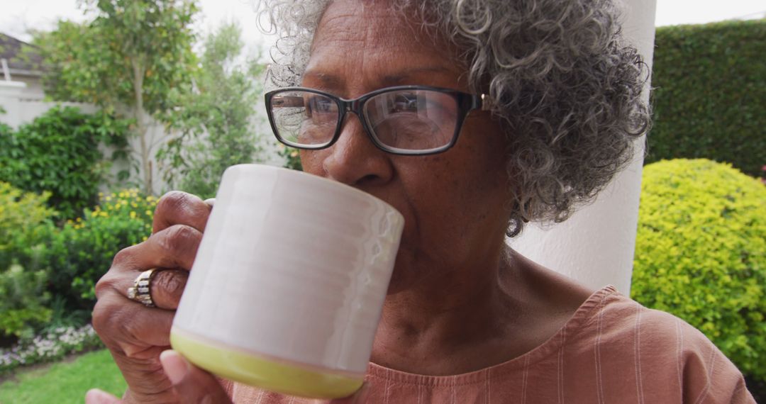 Senior Woman Enjoying Coffee in Garden - Free Images, Stock Photos and Pictures on Pikwizard.com