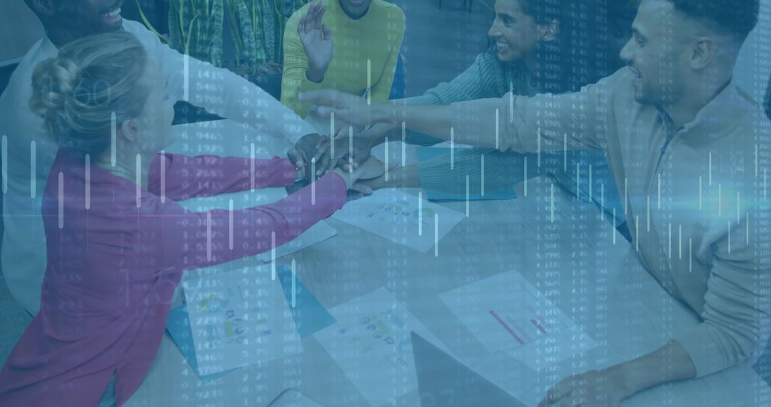 Team stacking hands over charts with data overlay showing collaboration and finance analytics