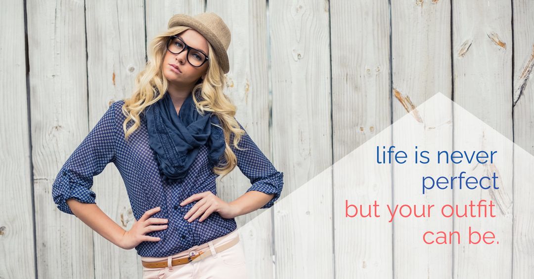 Confident fashionable woman posing against wooden background
