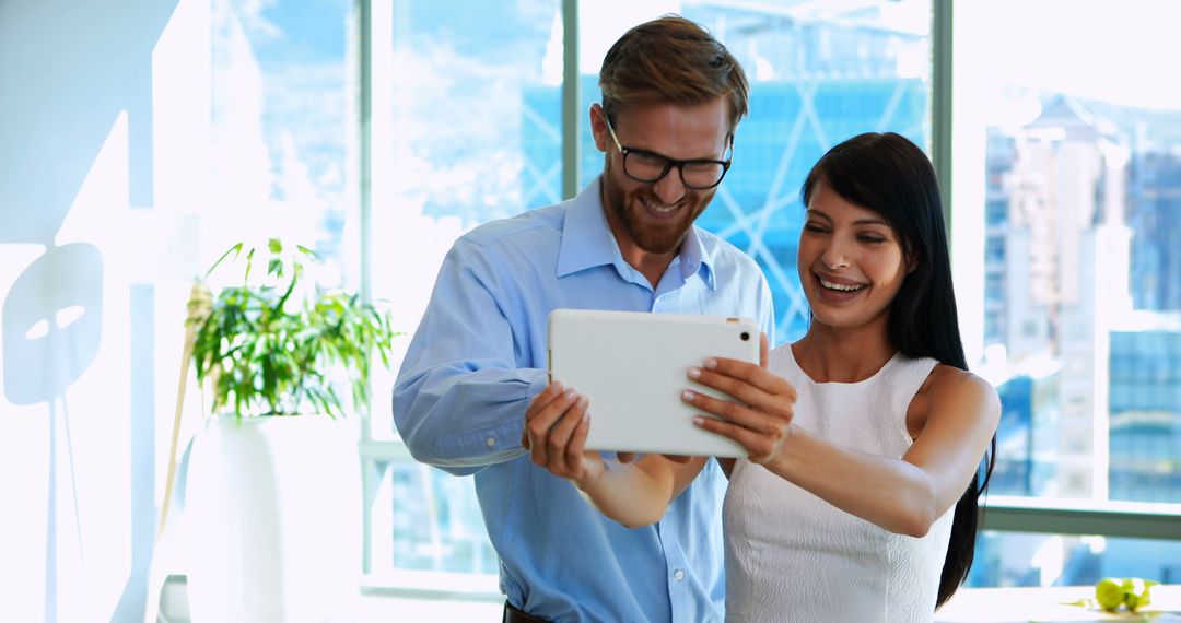 Successful Business Partners at Office Using Tablet