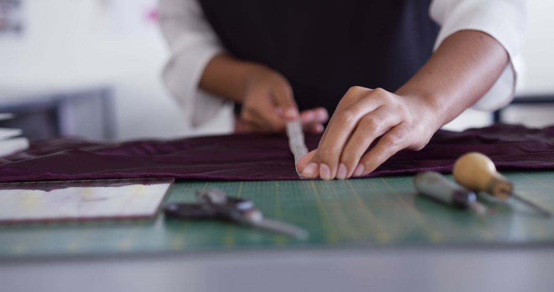 Fashion Designer Measuring Fabric at Sewing Station - Free Images, Stock Photos and Pictures on Pikwizard.com