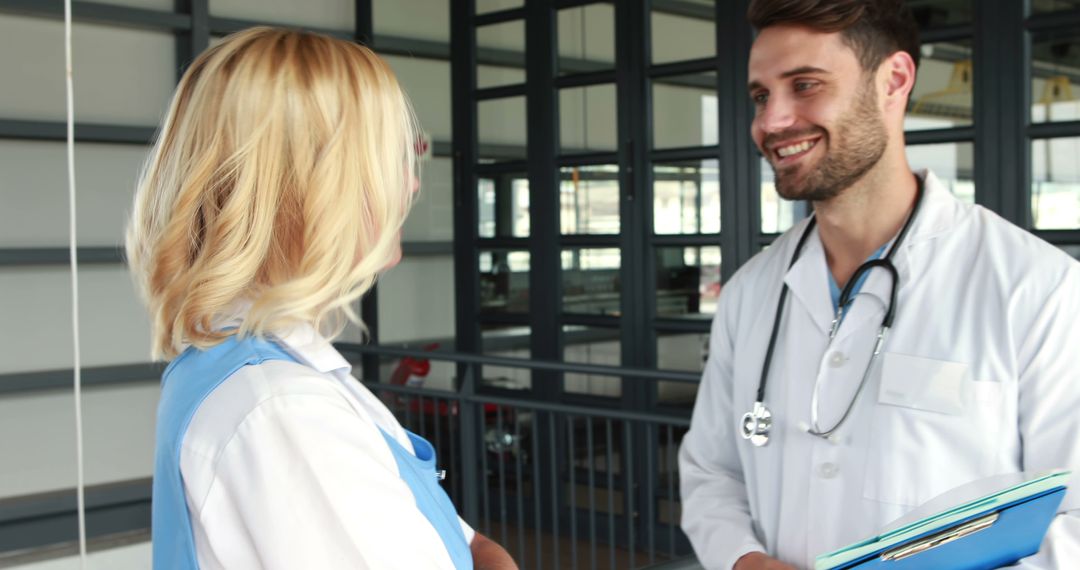 Medical Professionals Discussing Patient Care in Hospital - Free Images, Stock Photos and Pictures on Pikwizard.com