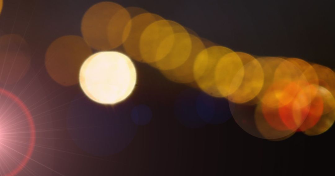 Colorful Bokeh Lights on Dark Background with Lens Flare Effect