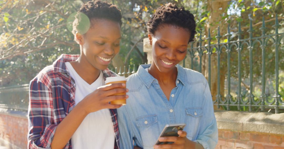 Smiling Twins with Coffee Exploring City