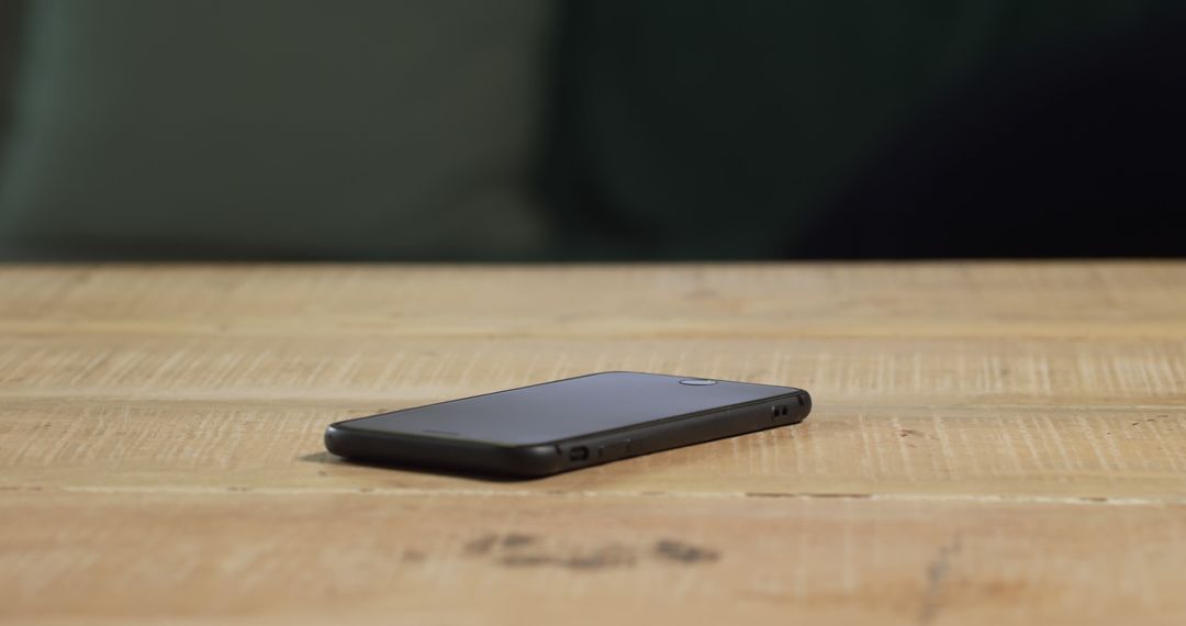 Smartphone on Wooden Table with Copy Space Suggesting Technology - Free Images, Stock Photos and Pictures on Pikwizard.com