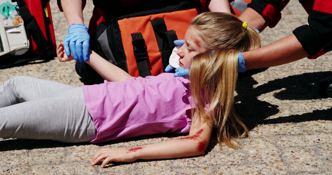 Emergency Medical Team Assisting Injured Girl on Street - Free Images, Stock Photos and Pictures on Pikwizard.com