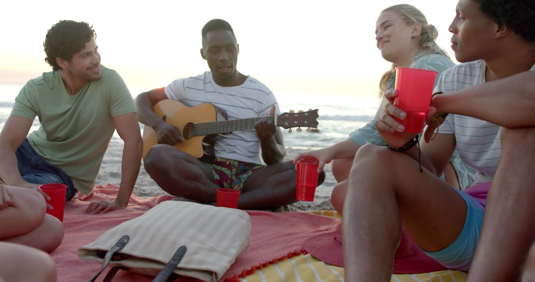 Friends Enjoying a Beach Gathering with Live Music