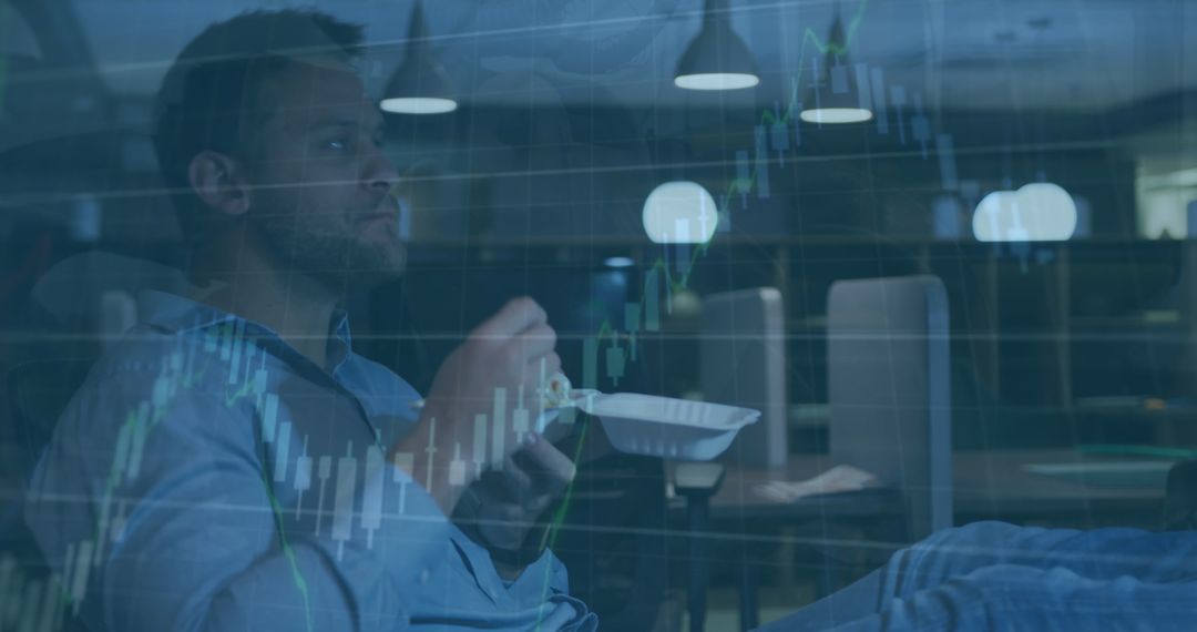 Businessman Analyzing Financial Data While Eating at Office