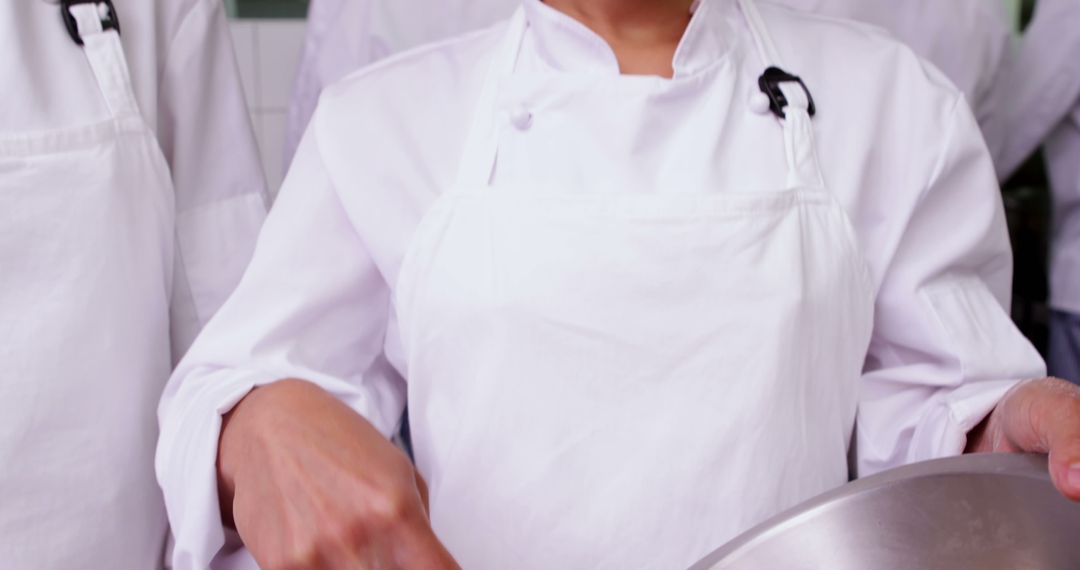 Anonymous Chef Preparing Food in Professional Kitchen - Free Images, Stock Photos and Pictures on Pikwizard.com