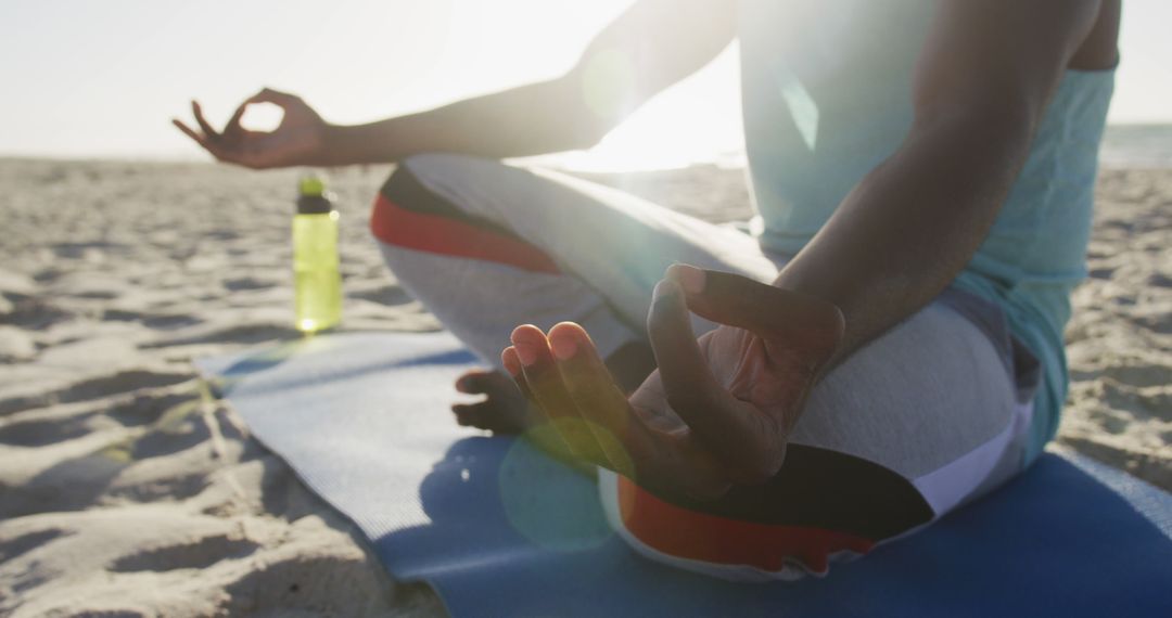 Person Meditating on Beach at Sunrise - Free Images, Stock Photos and Pictures on Pikwizard.com