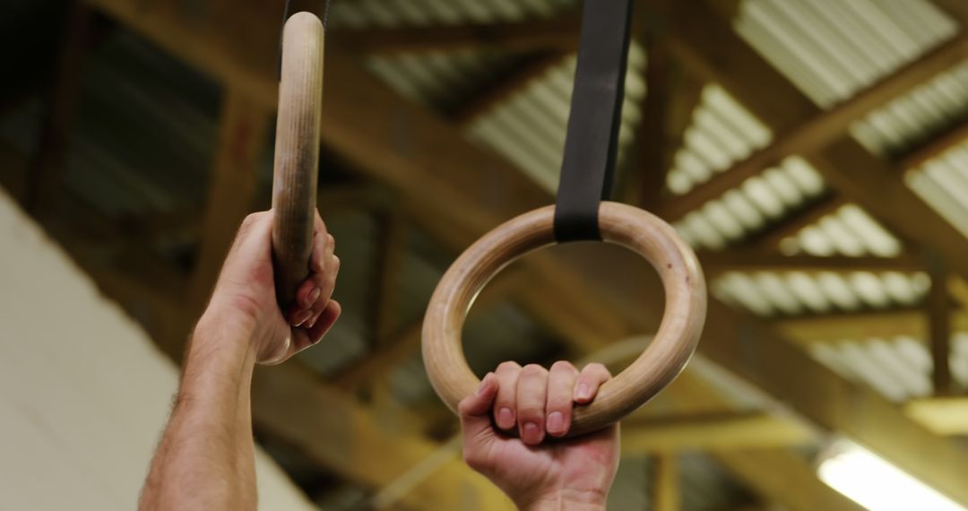 Hands Gripping Wooden Rings in Gym - Free Images, Stock Photos and Pictures on Pikwizard.com