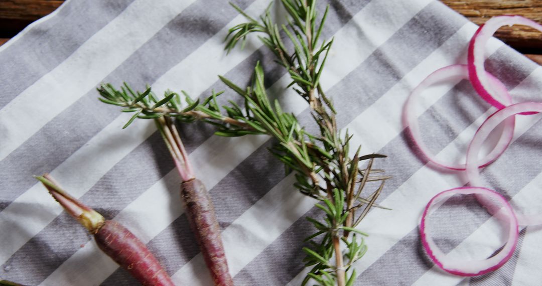 Fresh Rosemary and Carrots on Striped Tablecloth - Free Images, Stock Photos and Pictures on Pikwizard.com