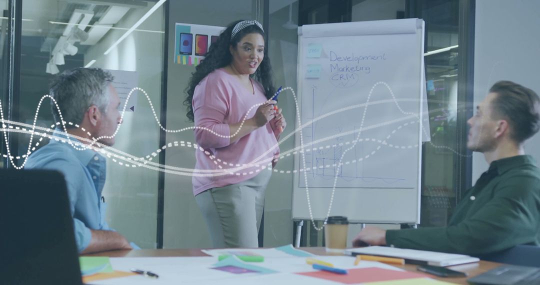 Diverse Team Discussing Development Strategies in Modern Office