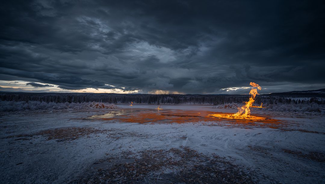 Flaming Geothermal Vent in Snowy Landscape at Sunset