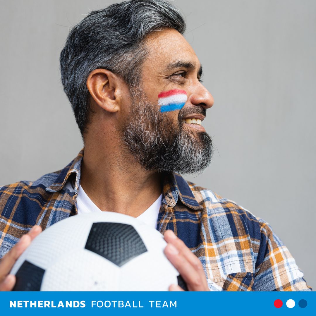 Enthusiastic Netherlands Football Fan with Painted Cheeks