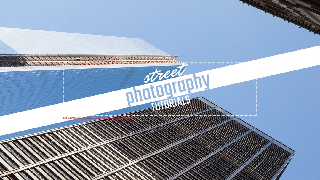 Urban skyscrapers reaching toward clear blue sky