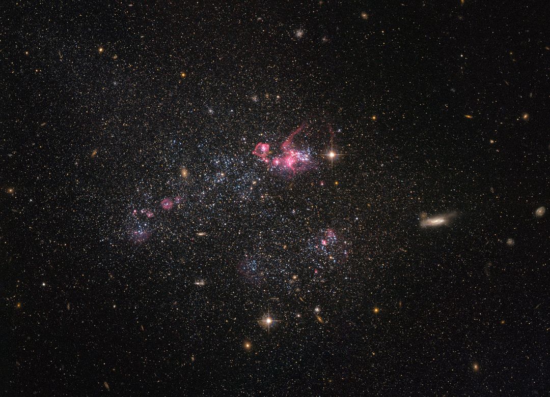 NASA/ESA Hubble Space Telescope Captures Irregular Dwarf Galaxy UGC 4459 - Free Images, Stock Photos and Pictures on Pikwizard.com