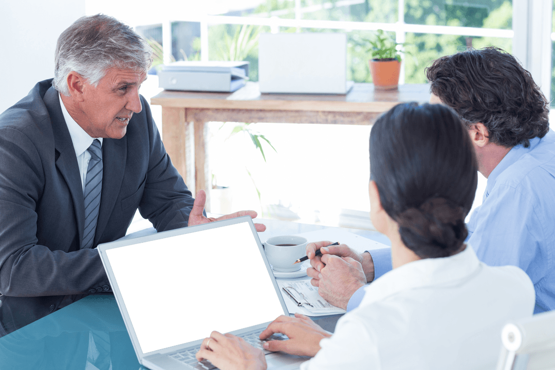 Transparent Laptop Mockup with Business Meeting Setting