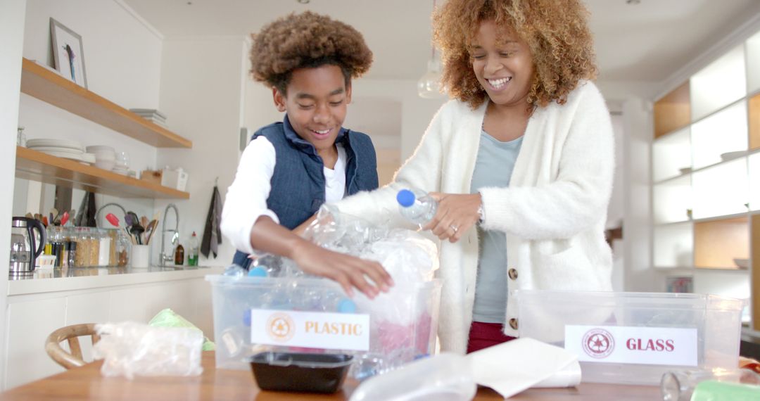 Mother and Daughter Sorting Recyclables in Kitchen - Free Images, Stock Photos and Pictures on Pikwizard.com