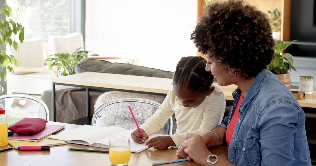 Mother Assisting Daughter with Homework in Modern Living Room