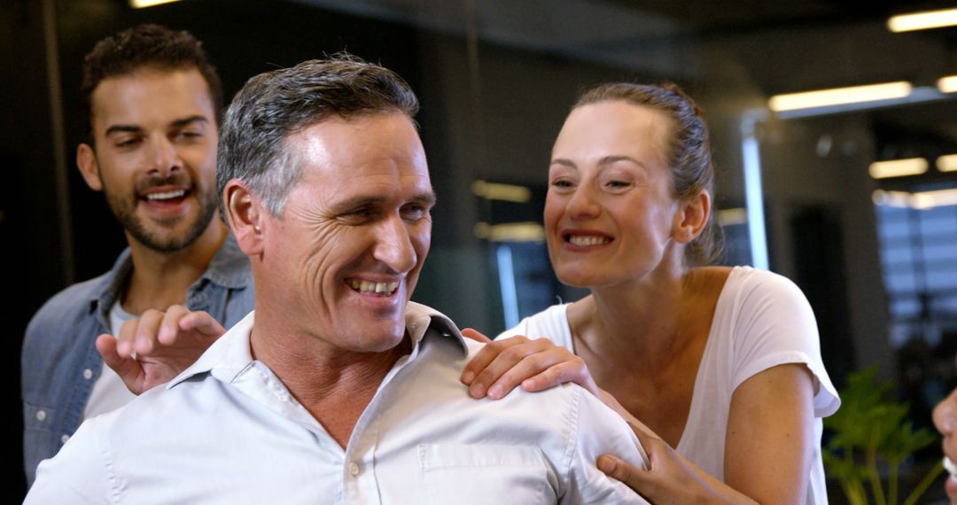 Happy Coworkers Laughing and Collaborating in Office