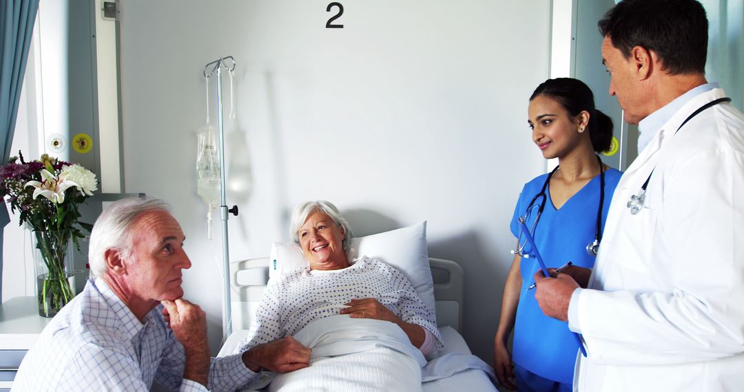 Doctors and Nurse Consulting Patient in Hospital Room - Free Images, Stock Photos and Pictures on Pikwizard.com