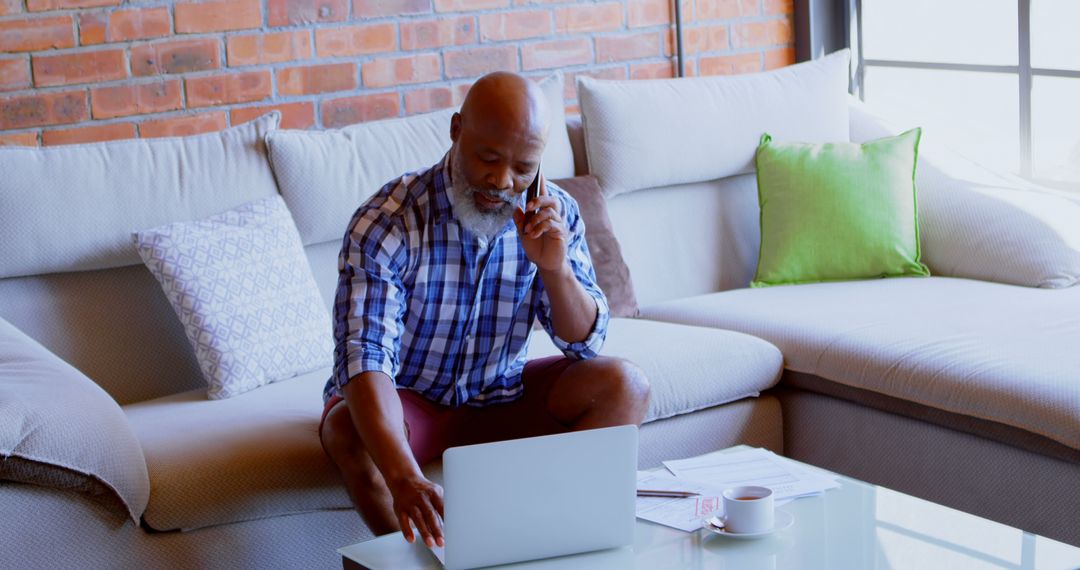 Mature African American Man Working from Home on Laptop - Free Images, Stock Photos and Pictures on Pikwizard.com