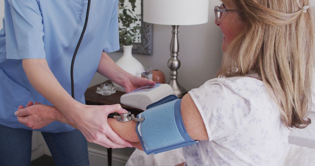 Home Healthcare Worker Measuring Senior Patient's Blood Pressure - Free Images, Stock Photos and Pictures on Pikwizard.com