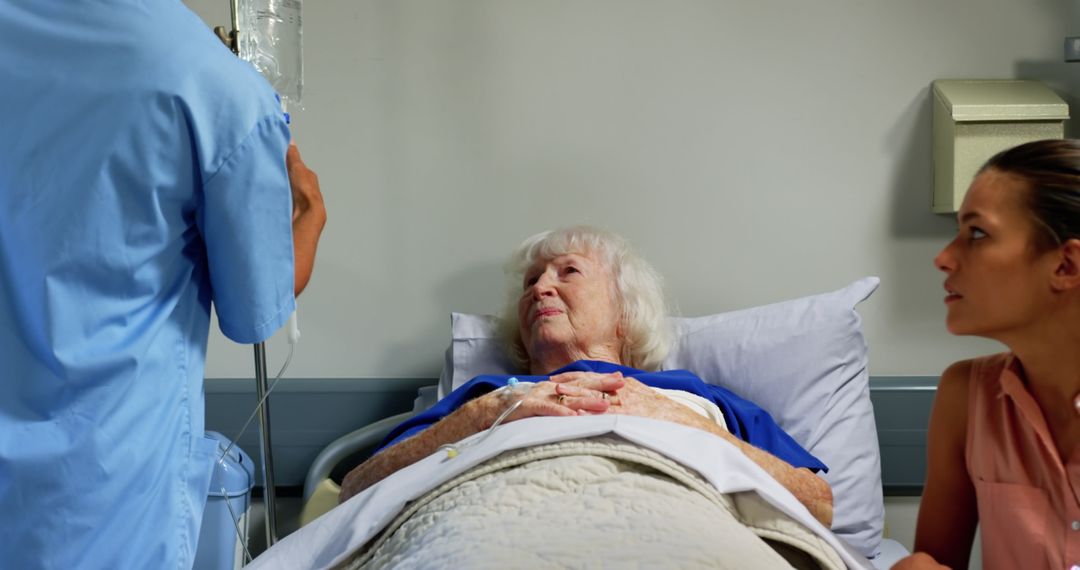 Nurse Caring for Elderly Woman in Hospital Bed - Free Images, Stock Photos and Pictures on Pikwizard.com