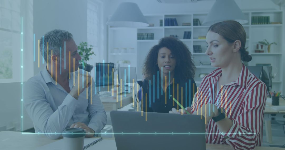 Diverse Professionals Analyzing Digital Financial Charts in Office