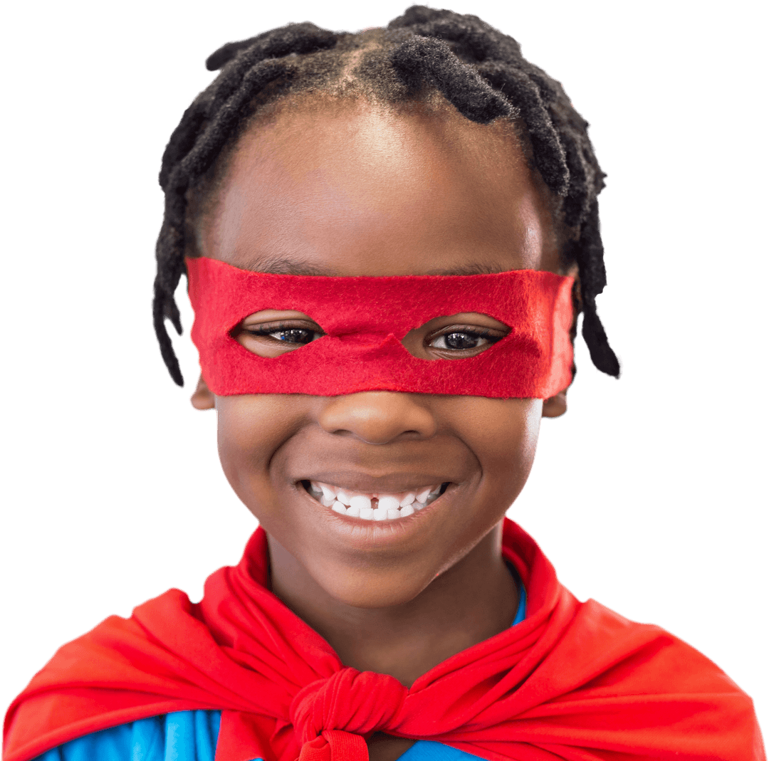 Joyful Boy Smiling with Red Eye Mask Showing Creativity and Fun