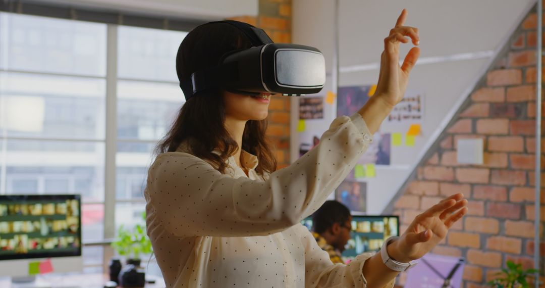 Graphic Designer Using VR Headset in Modern Office