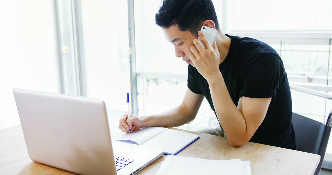 Business Professional Multitasking in Modern Office Environment