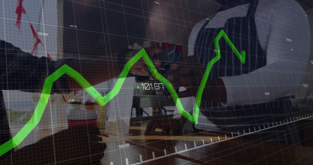 Two Professionals Shaking Hands Over Busy Workspace