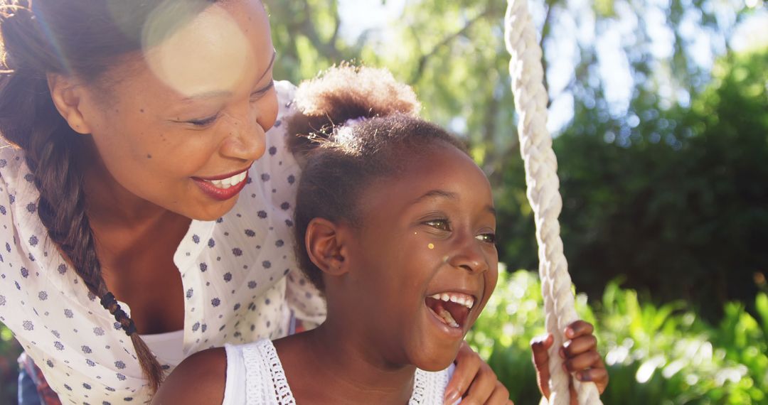 Mother and Daughter Laughing Together Outside in Daylight - Free Images, Stock Photos and Pictures on Pikwizard.com