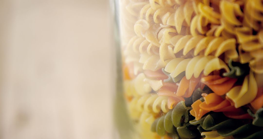 Rustic Fusion of Tri-Colored Fusilli Pasta in Glass Jar
