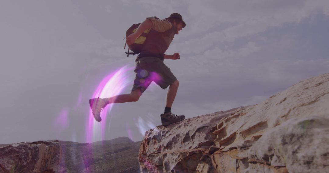 Adventurous Hiker Leaping Trail On Desert Cliff Edge