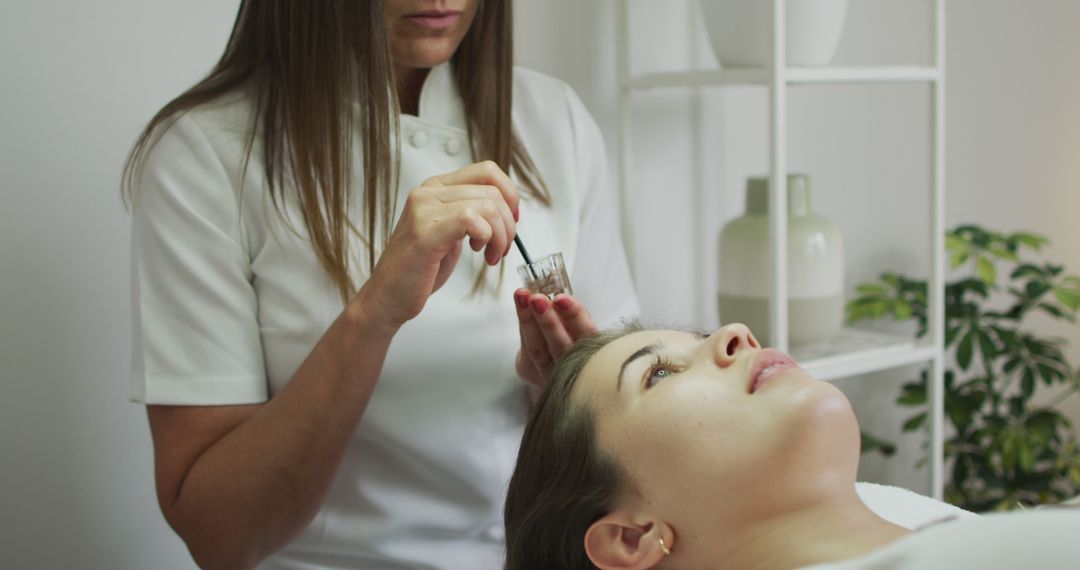 Beauty Professional Applying Eyebrow Tint on Client - Free Images, Stock Photos and Pictures on Pikwizard.com