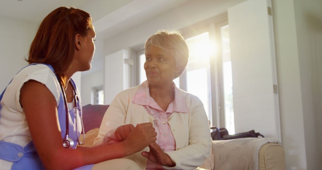 Healthcare worker providing emotional support to elderly patient at home - Free Images, Stock Photos and Pictures on Pikwizard.com